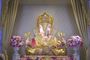 Beautiful Lord Ganesha Dagadusheth statue enshrined in a Hindu temple